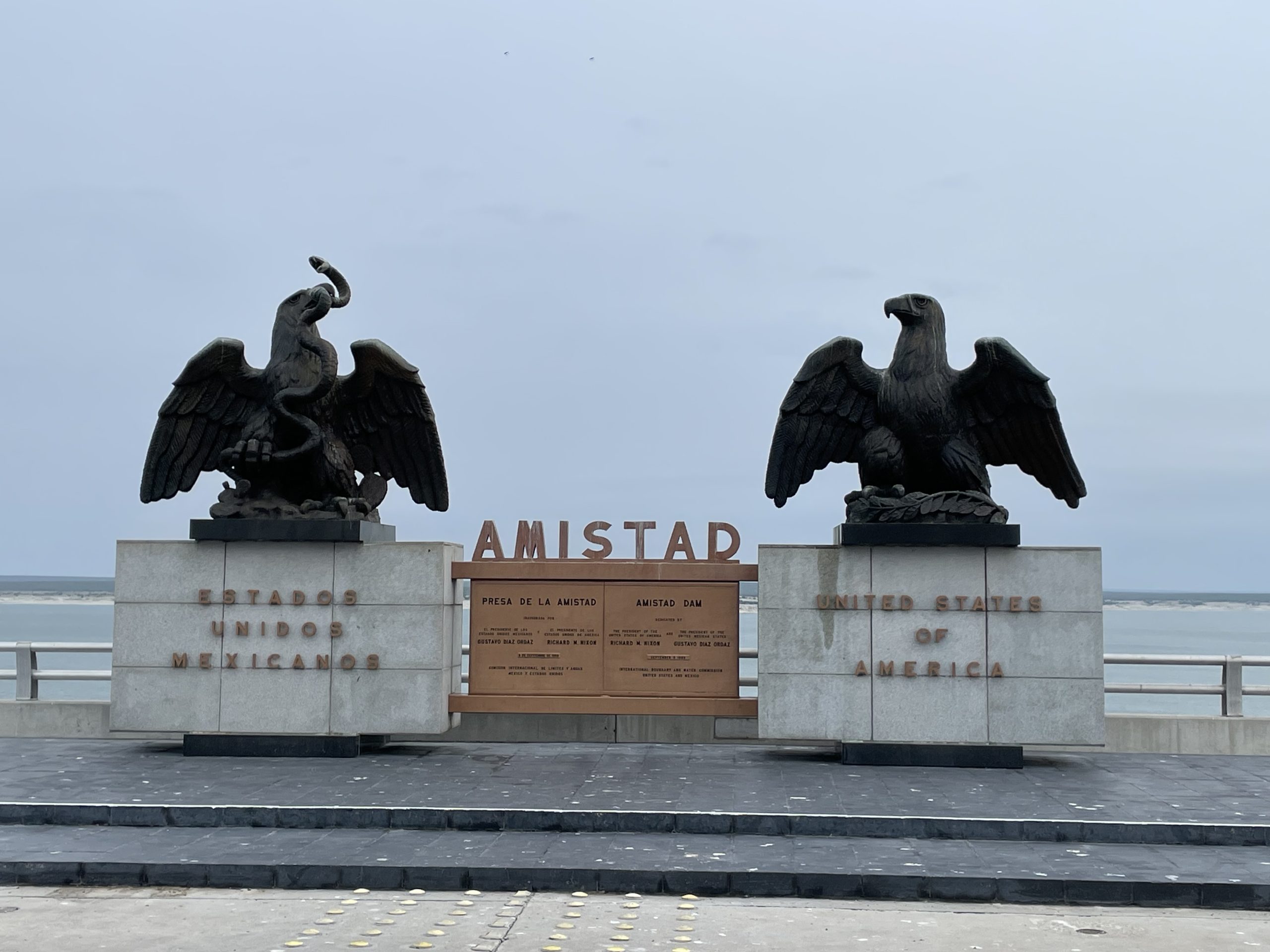 Statues and plaque at the International Boundary Line on Amistad Dam - dedicated on September 8, 1969
