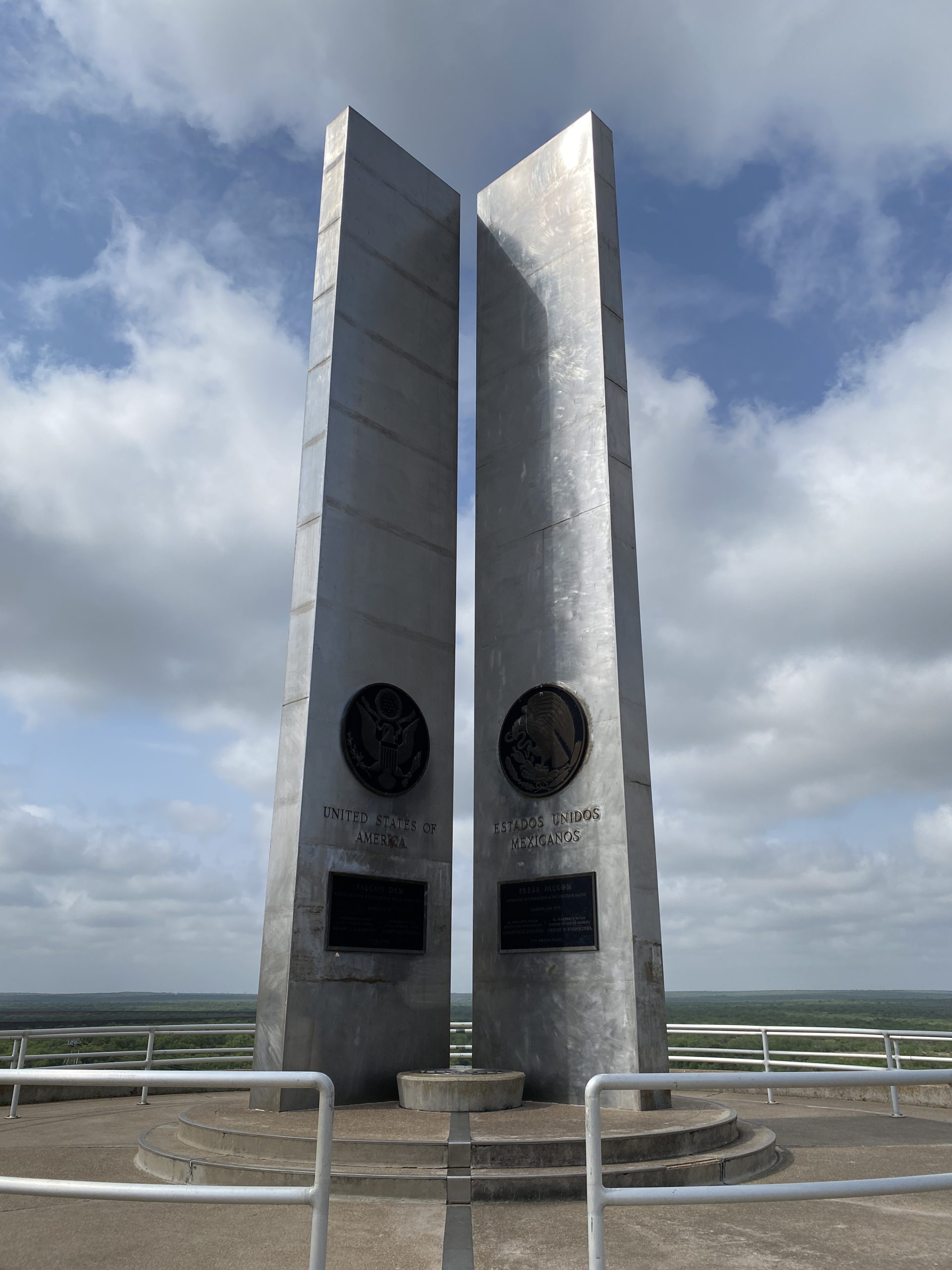 Monuments and plaque at the International Boundary Line on Falcon Dam - dedicated on October 19, 1953