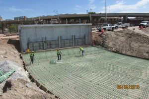 Tying rebar for the College Arroyo Overchute sluiceway to the Rio Grande as part of the Lower Reach of American Canal