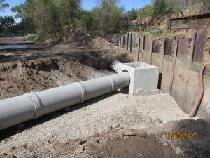 Construction of new 30" RCP piping and shallow manhole for IOI MH#89 after monsoon damaged structure and caused sewage spill in 2017