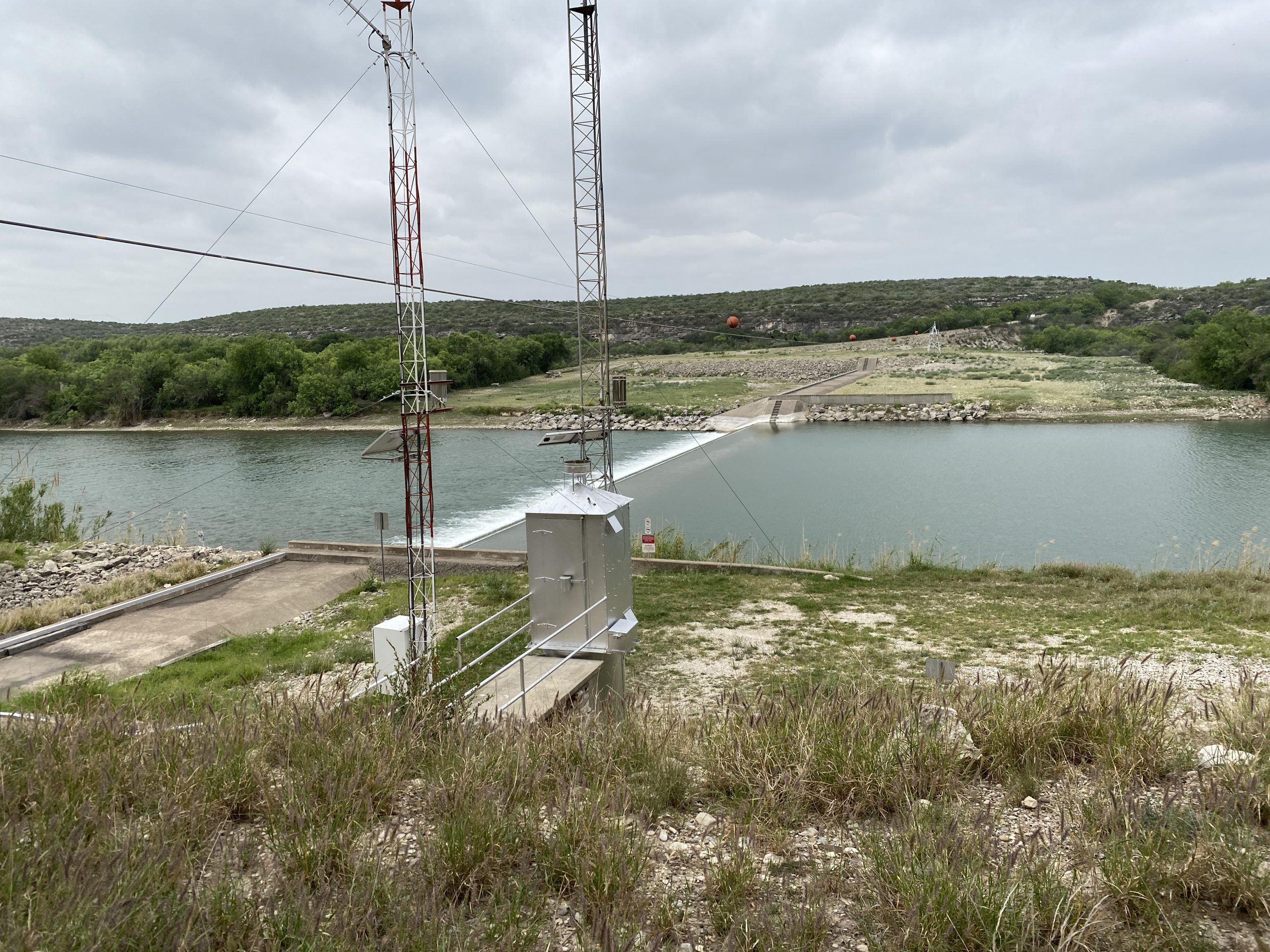 Concrete weir across Rio Grande just downstream of Amistad Dam with gaging station